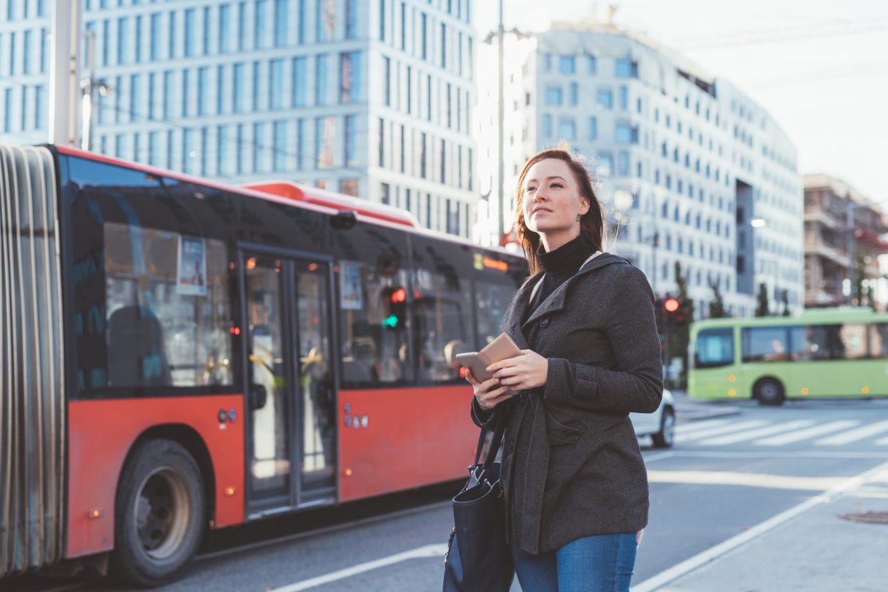 young-woman-outdoor-waiting-bus-stop.jpg